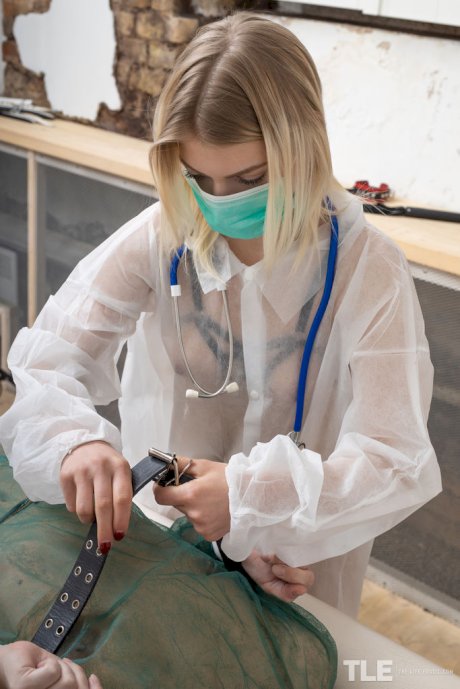 Female doctor restrains a patients before forcing her into lesbian sex acts