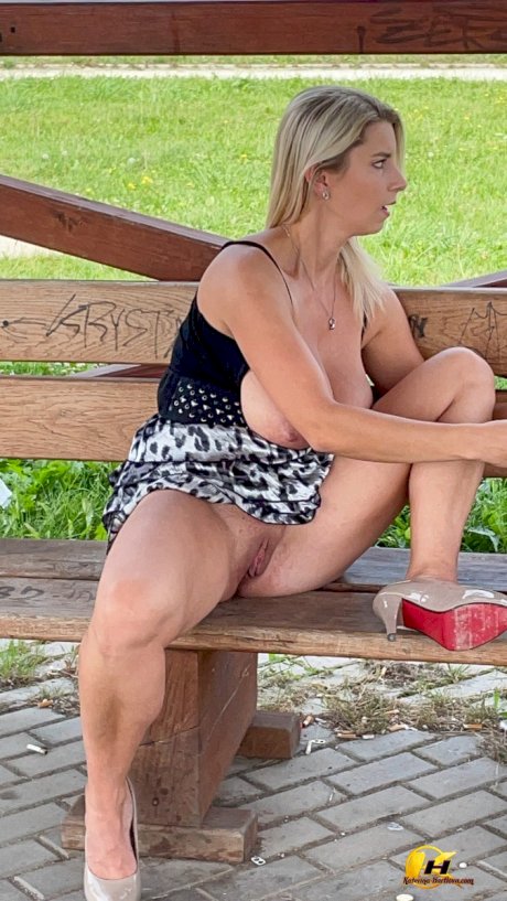 Big titted blonde Katerina Hartlova masturbates on a public bench in heels