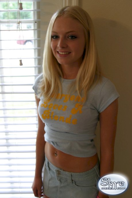 Blonde amateur Skye Model models by herself in a short skirt