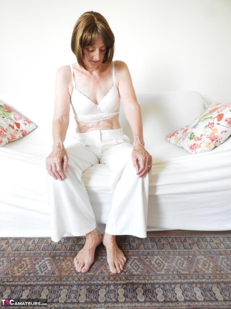 Barefoot granny Kat Kitty gets completely naked during solo action