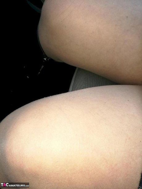 Hairy grandmother slides her upskirt panties aside to expose her vagina