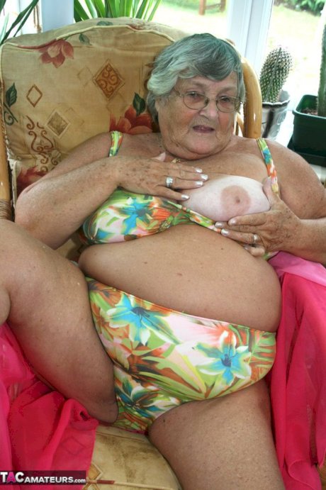 Horny old granny in glasses disrobes to reveal huge saggy tits & big BBW ass