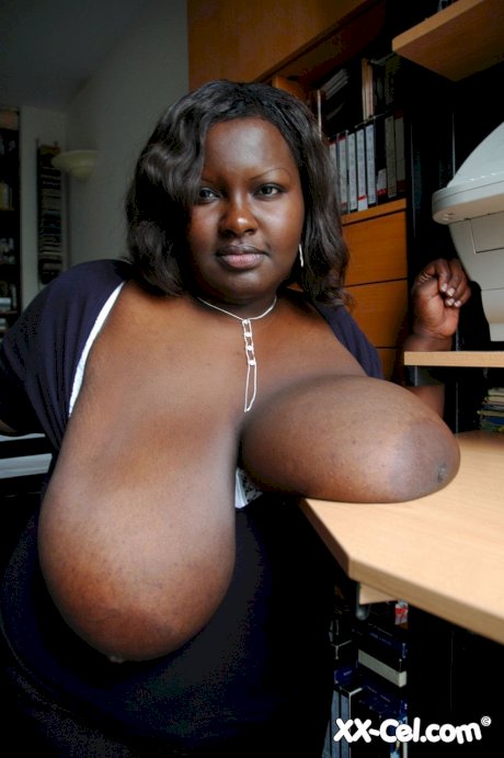 Ebony BBW Mariana Kodjo unleashing her massive tits and playing with them