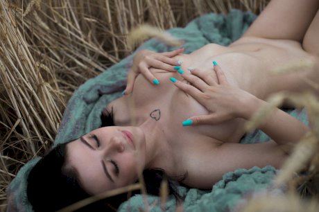 Breathtaking amateur babe Lyalya massages her big tits in a wheat field