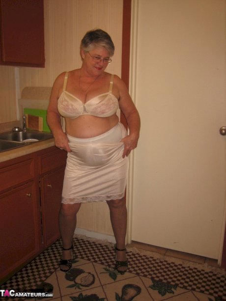 Old woman Girdle Goddess strips to pantyhose in her kitchen