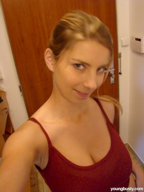Young busty blonde Kathy displaying her large boobs & her great ass
