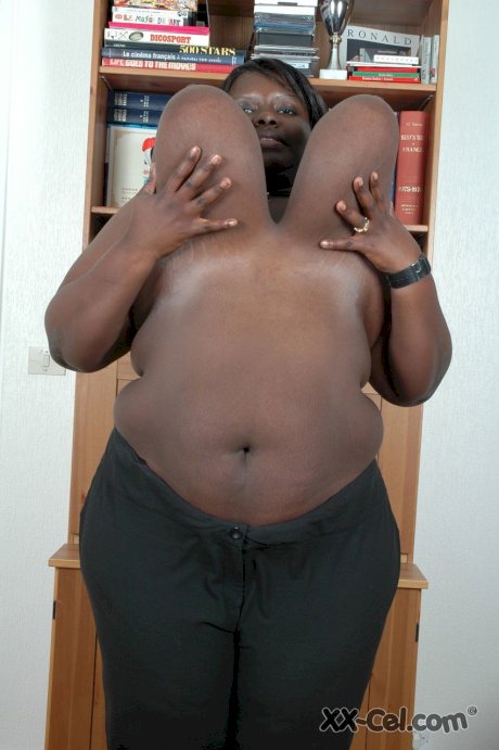 Ebony BBW Mariana Kodjo unleashes her enormous tits and plays with them