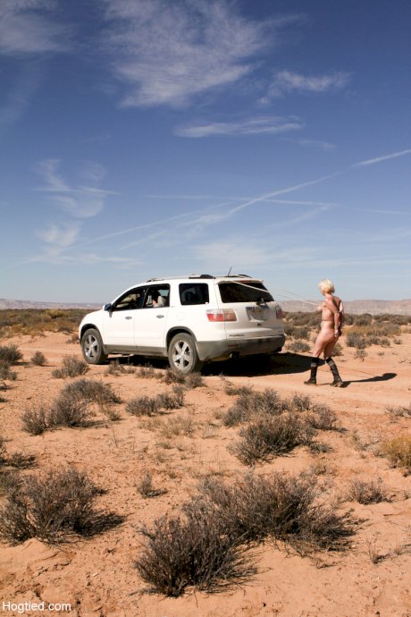 Naked Cherry Torn gets bound to a car & pulled by her big tits in the desert