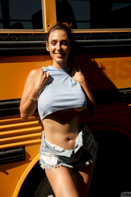 Stunner with big tits Rhonda Biasi posing braless in sexy shirt & shorts