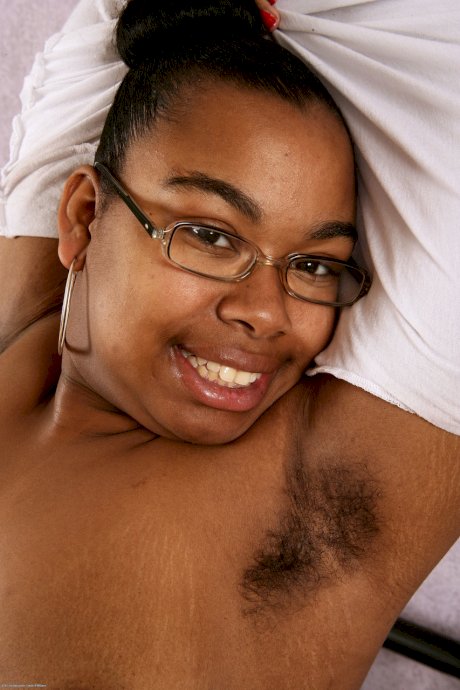 Cute nerdy ebony Monica Jimenez exposes her chubby body and hairy pussy