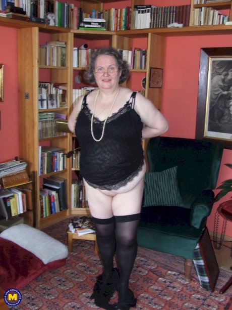 Fat mature woman Birgid strips her clothes & lingerie to show her huge body