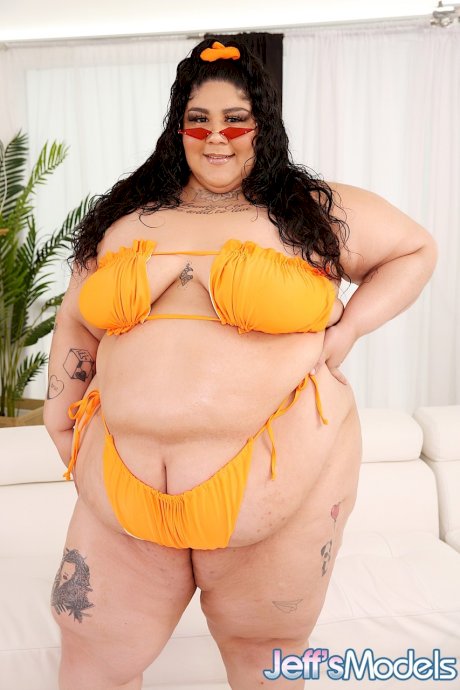 Brunette SSBBW Crystal Blue discards a bikini to get completely naked