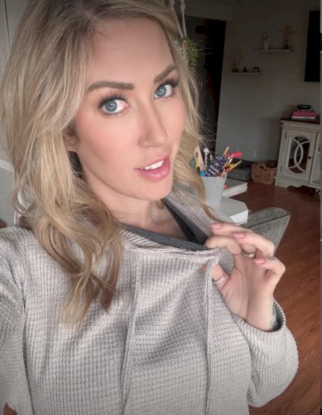 Blonde solo model Capri Cavanni takes self shots during non-nude action
