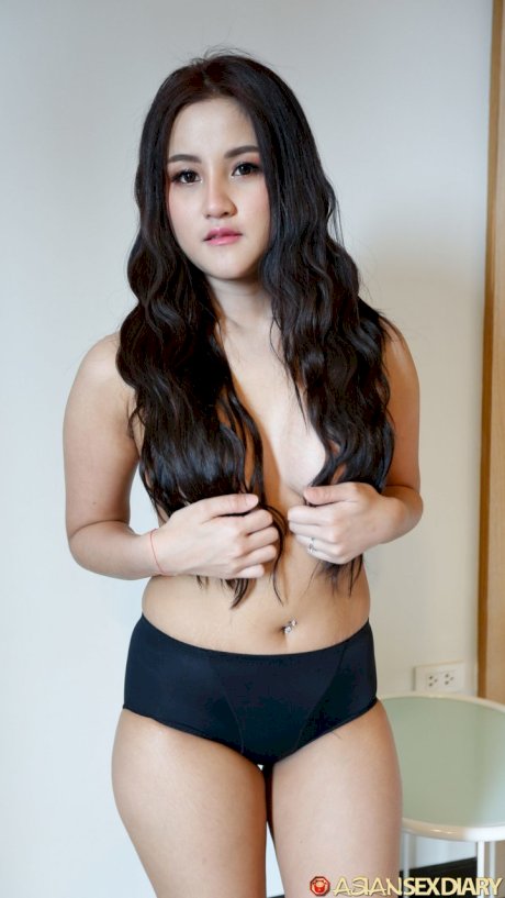 Beautiful Asian girl Zin shows her big tits while undressing for POV sex