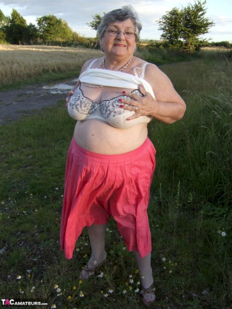 Obese oma Grandma Libby exposes her huge ass while in a field by a rural road