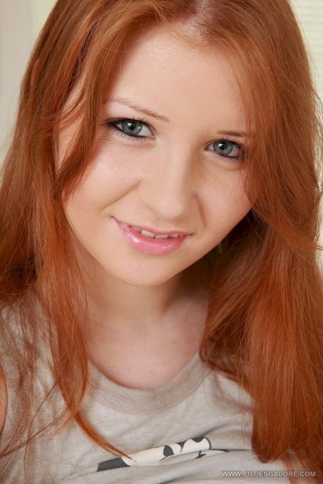 Innocent redhead Jess shows her big tits and masturbates with a dildo