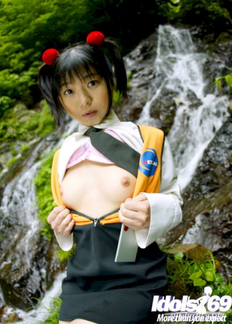 Smiley asian coed revealing her tiny titties and bushy cunt outdoor