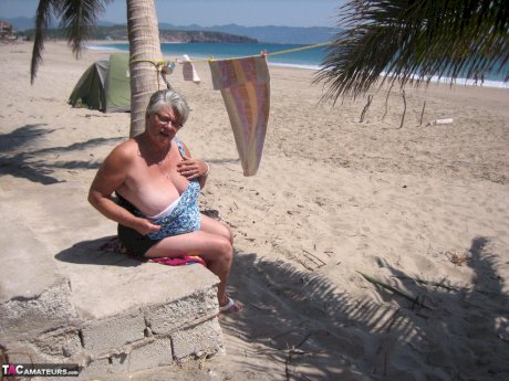 Fat granny Girdle Goddess takes off swimwear to pose nude at the ebach