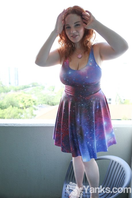 Chubby solo girl with curly red hair unleashes her incredible breasts