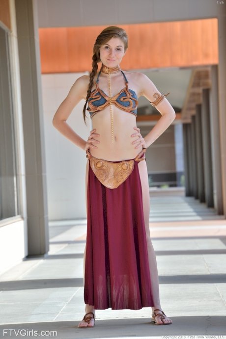 Adorable teen in a princess costume Eva toys her cunt in public