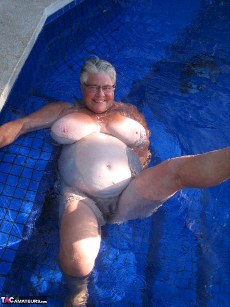 Fat nan Girdle Goddess goes for a skinny dip in a backyard pool