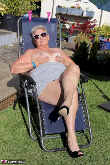 Fat nan Valgasmic Exposed shows her tits and snatch on a backyard lounge chair