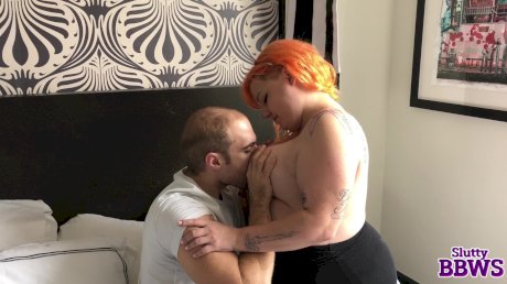 Redheaded fatty concludes a handjob with sperm on her face and tits