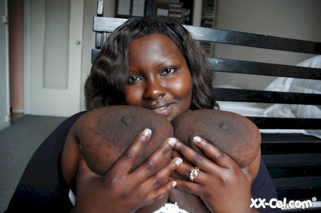 Ebony BBW Mariana Kodjo unleashing her massive tits and playing with them