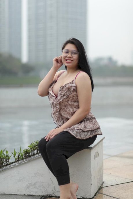 Beautiful chubby babe in glasses teases with her big boobs outdoors