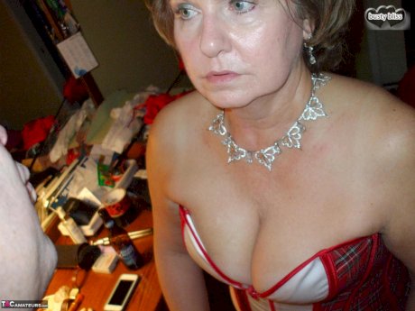 Mature lady Busty Bliss sports nipple clamps after being handcuffed