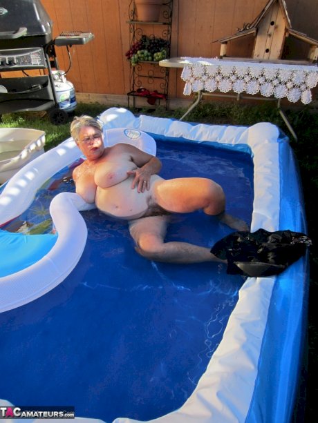 Fatty mature granny Girdle Goddess peels to enjoy wading pool skinny dip