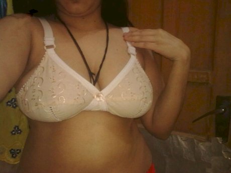 Overweight Indian student shows her bare mid-section in a brassiere