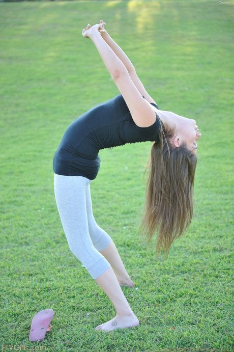 Nerdy teen girl takes off her yoga pants to expose her tight ass and bald cunt