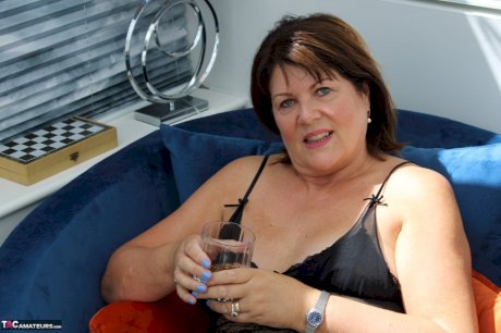 Mature plumper finger spreads her pussy lips while modelling lingerie