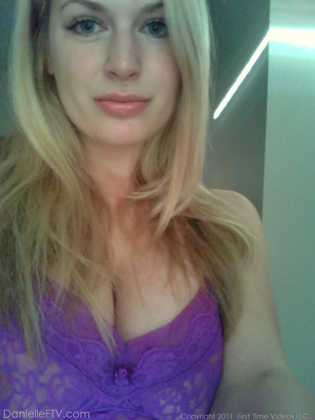 Big titted blonde amateur Danielle takes naughty selfies around the house