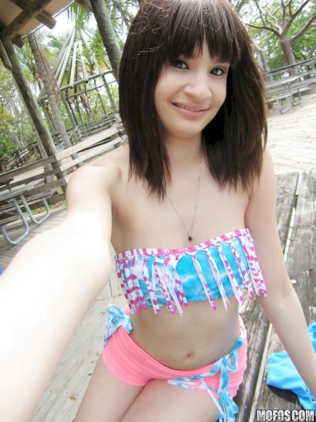 Latina babe Jessi Grey dose self shots of her tiny tits outdoor