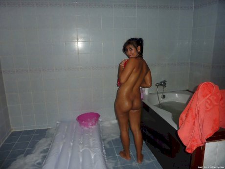 Busty Thai chick gets drunk and strips naked for boyfriend and bath