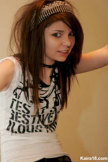 Young brunette Kaira 18 takes off her glasses while modelling non nude