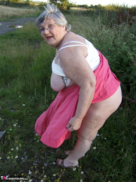 Obese oma Grandma Libby exposes her huge ass while in a field by a rural road