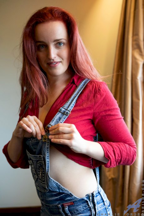 Redhead housewife Charlie Forde takes self shots while getting totally naked