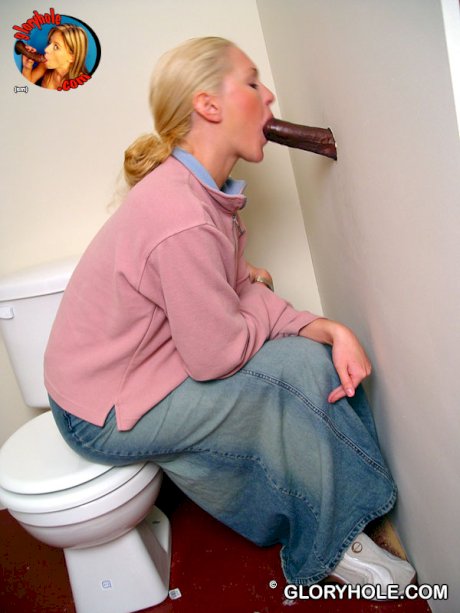 Blonde girl Jamie sits on the toilet and blows a black gloryhole dong