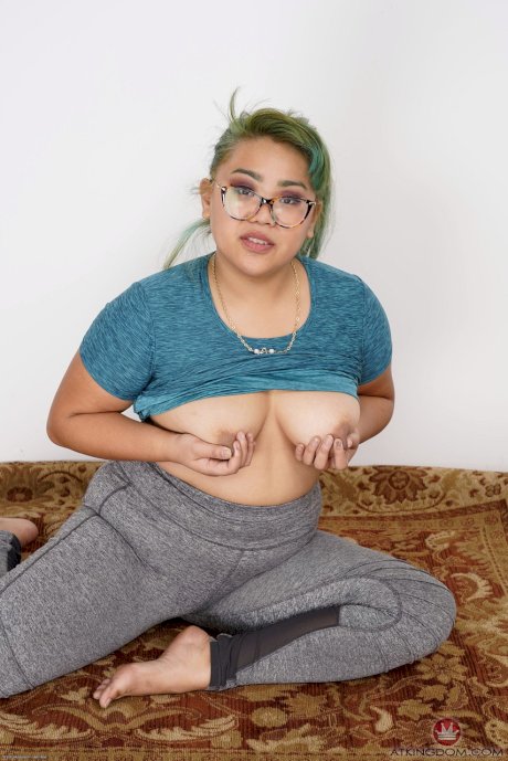 Chubby Asian babe Manila Bey unveils her big saggy tits and huge ass