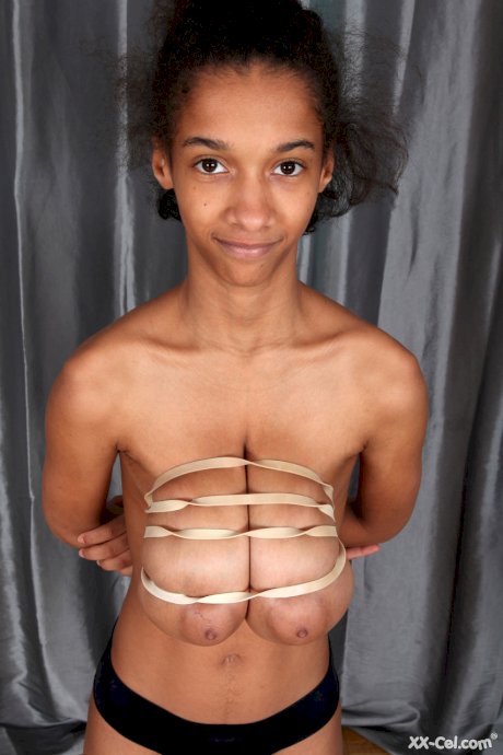 Ebony Addisson shows off her huge breasts and squeezes them in undies