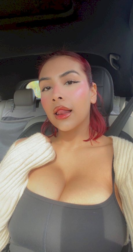Buxom babe Angel takes selfies showing her big boobs & her trimmed pussy