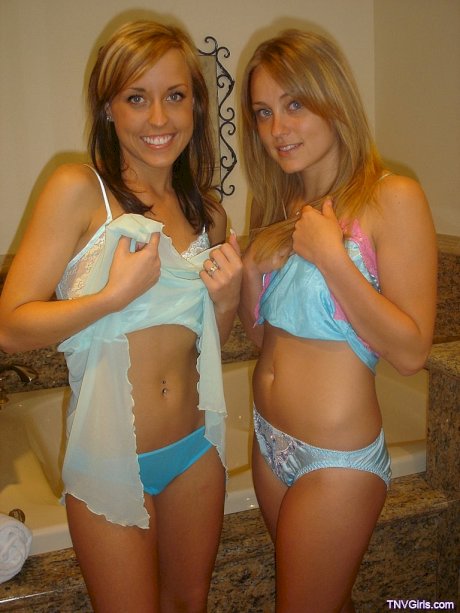 Sexy lesbian teens kiss passionately while showing off their sweet tits