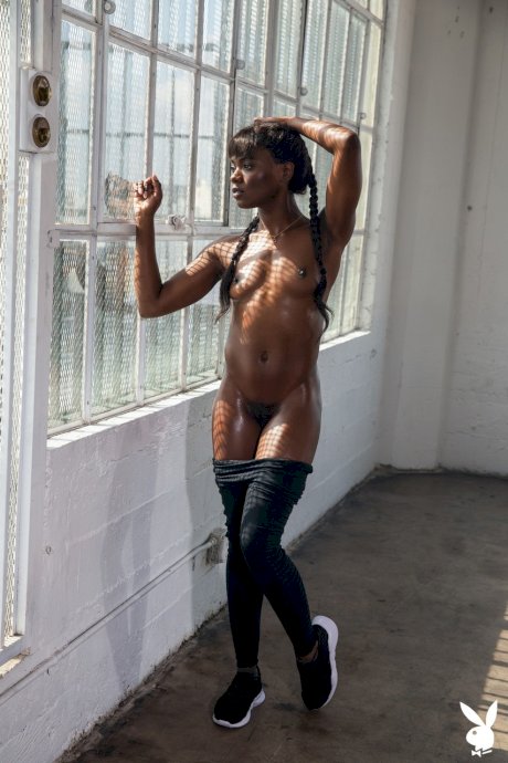 Hot black girl Ana Foxxx touts her phat ass during Playboy centerfold shoot