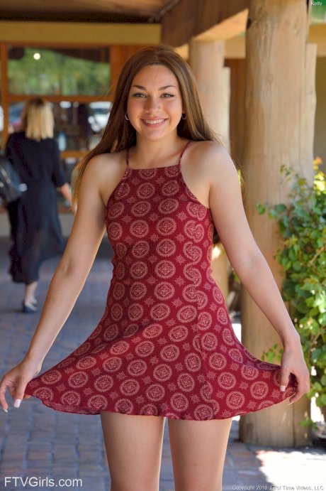 Petite teen Kelly hikes her dress up before fingering and toying her holes