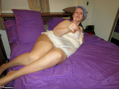 Fat granny Bunny Gram works free of handcuffs before sucking cock on her bed