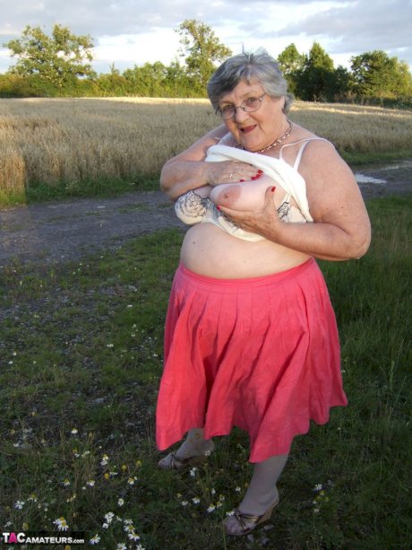 Obese oma Grandma Libby exposes her huge ass while in a field by a rural road