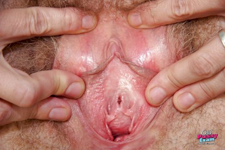 Busty mature nurse spreading her legs and playing with a gyno tool